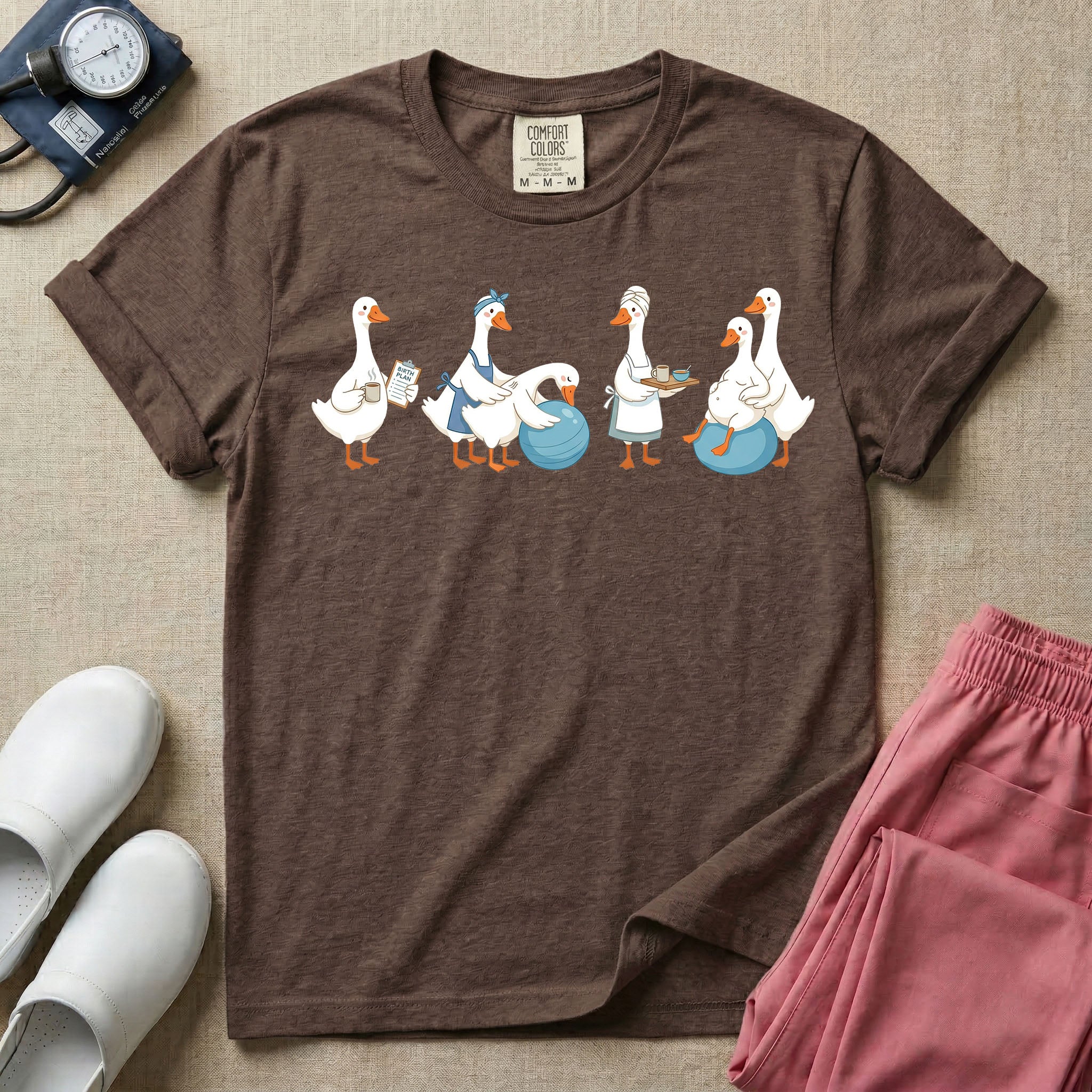 A graphic featuring a row of ducks playfully acting out a labor and delivery scene, including a duck checking a birth plan clipboard, ducks assisting a pregnant duck on a birthing ball, and a duck carrying a recovery tray, designed for labor and delivery nurses, midwives, and doulas.