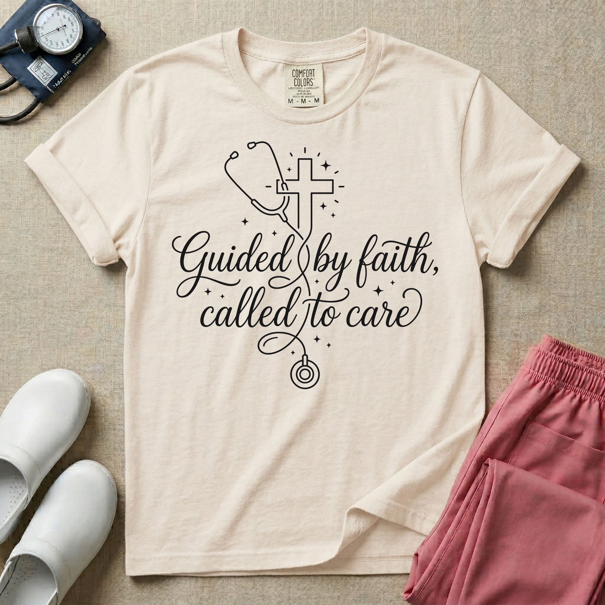 A graphic featuring a minimalist white line art stethoscope that loops into the shape of a cross, accompanied by the phrase "Guided by faith, called to care" in an elegant cursive script surrounded by small stars, designed for nurses.