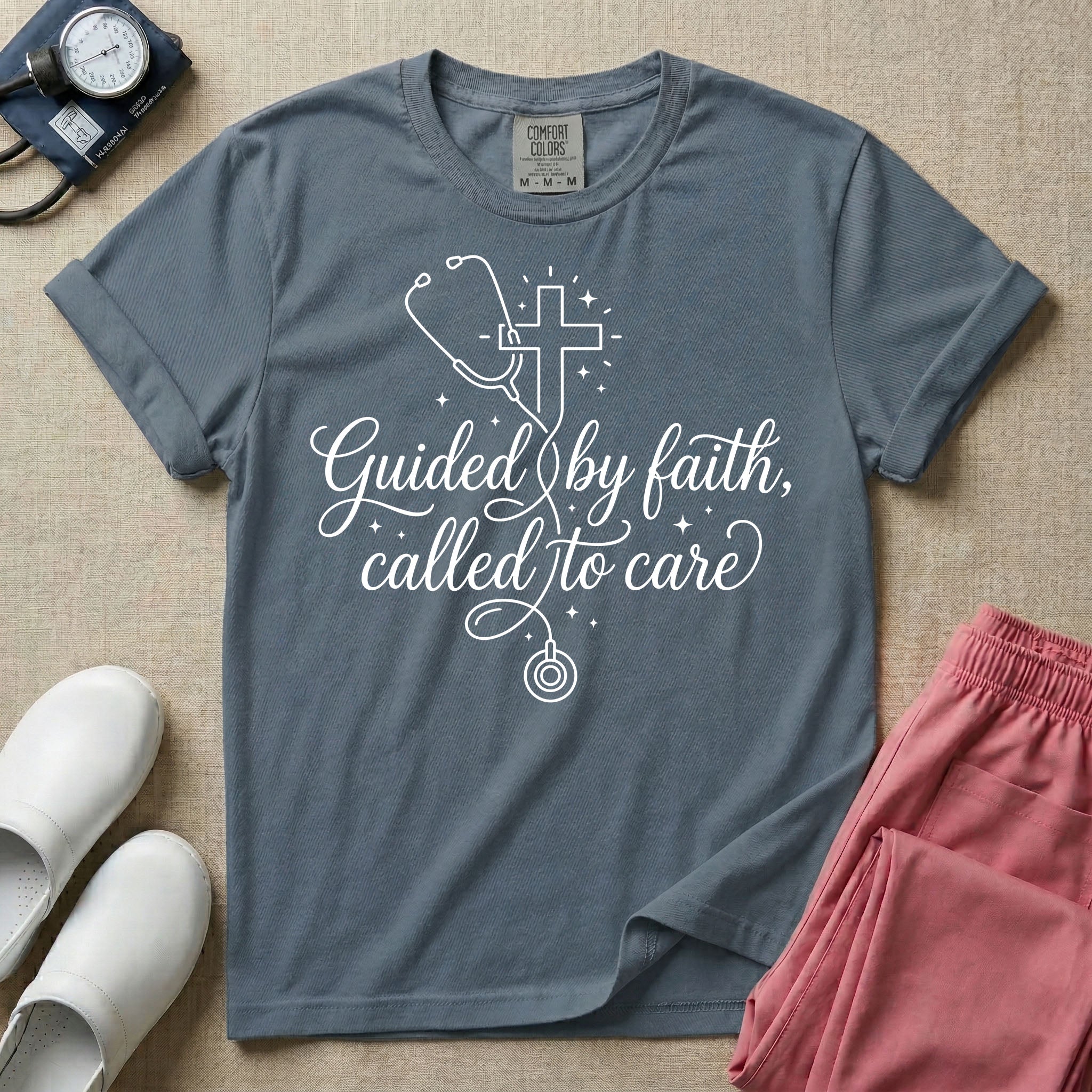 A graphic featuring a minimalist white line art stethoscope that loops into the shape of a cross, accompanied by the phrase "Guided by faith, called to care" in an elegant cursive script surrounded by small stars, designed for nurses.