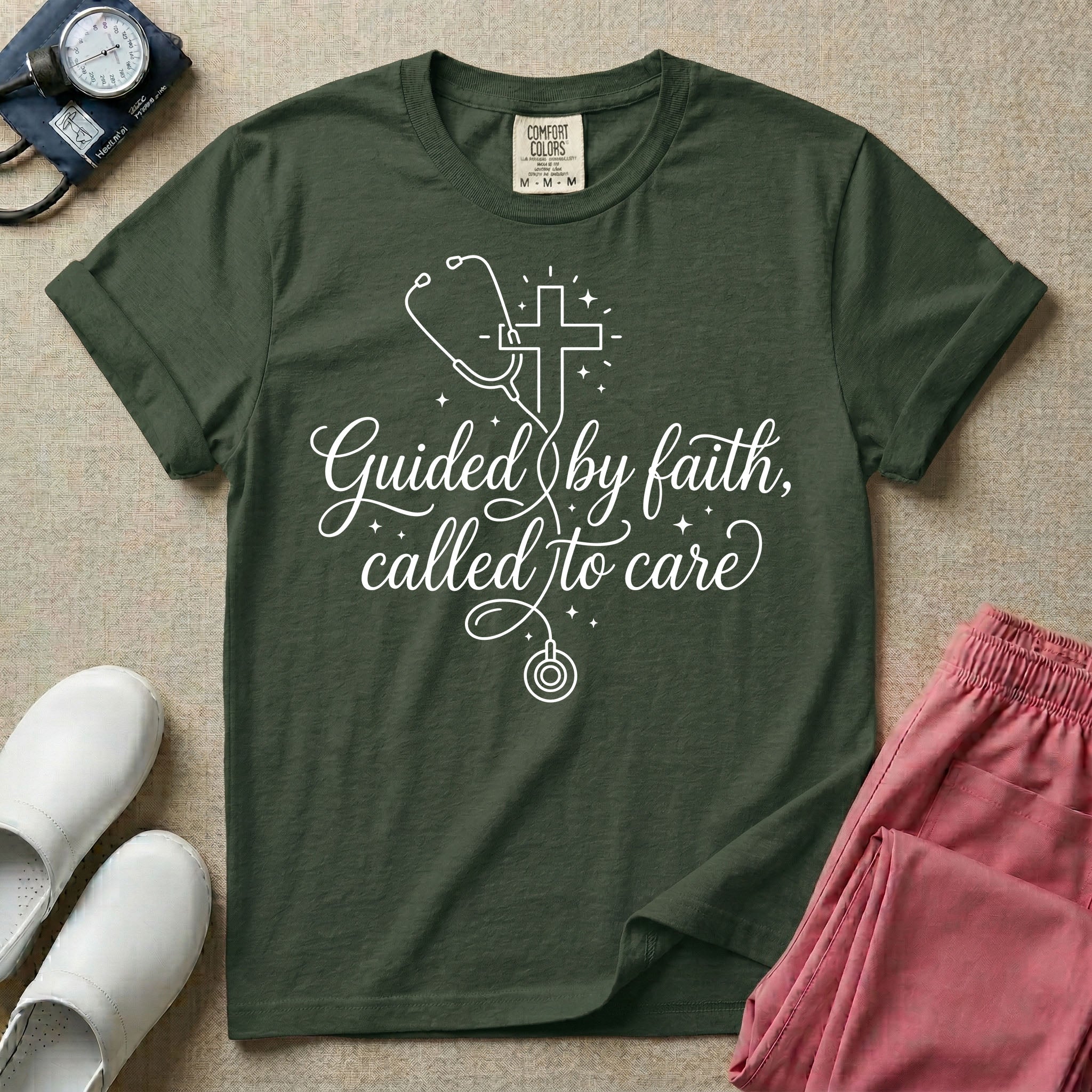 A graphic featuring a minimalist white line art stethoscope that loops into the shape of a cross, accompanied by the phrase "Guided by faith, called to care" in an elegant cursive script surrounded by small stars, designed for nurses.