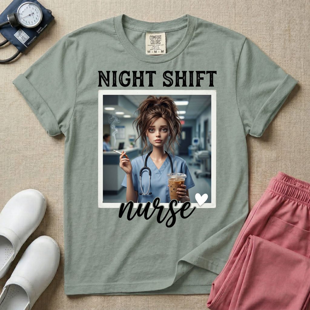 A graphic featuring the words "NIGHT SHIFT" above a framed image of an exhausted nurse in scrubs holding a lit cigarette and a large iced coffee, with the word "nurse" in cursive and a small heart below, designed for general nursing.