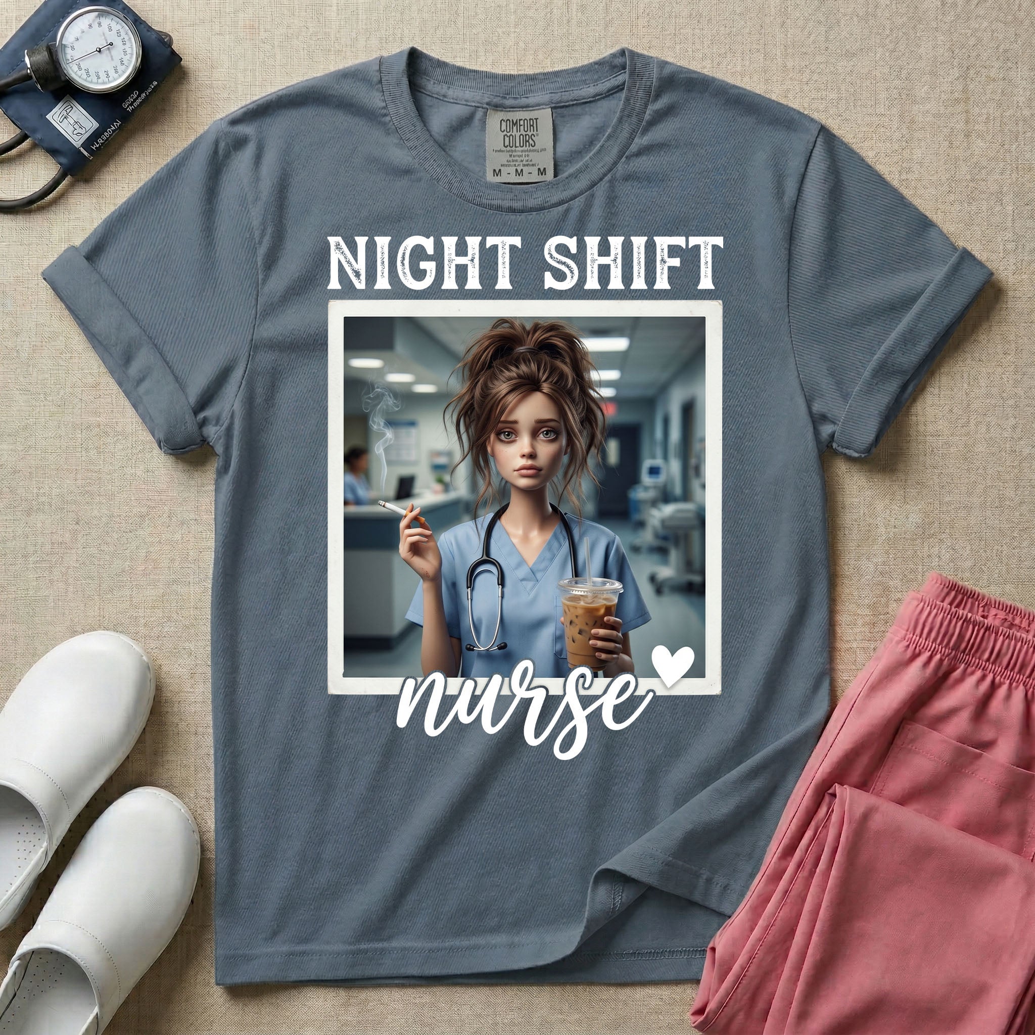 A graphic featuring the words "NIGHT SHIFT" above a framed image of an exhausted nurse in scrubs holding a lit cigarette and a large iced coffee, with the word "nurse" in cursive and a small heart below, designed for general nursing.