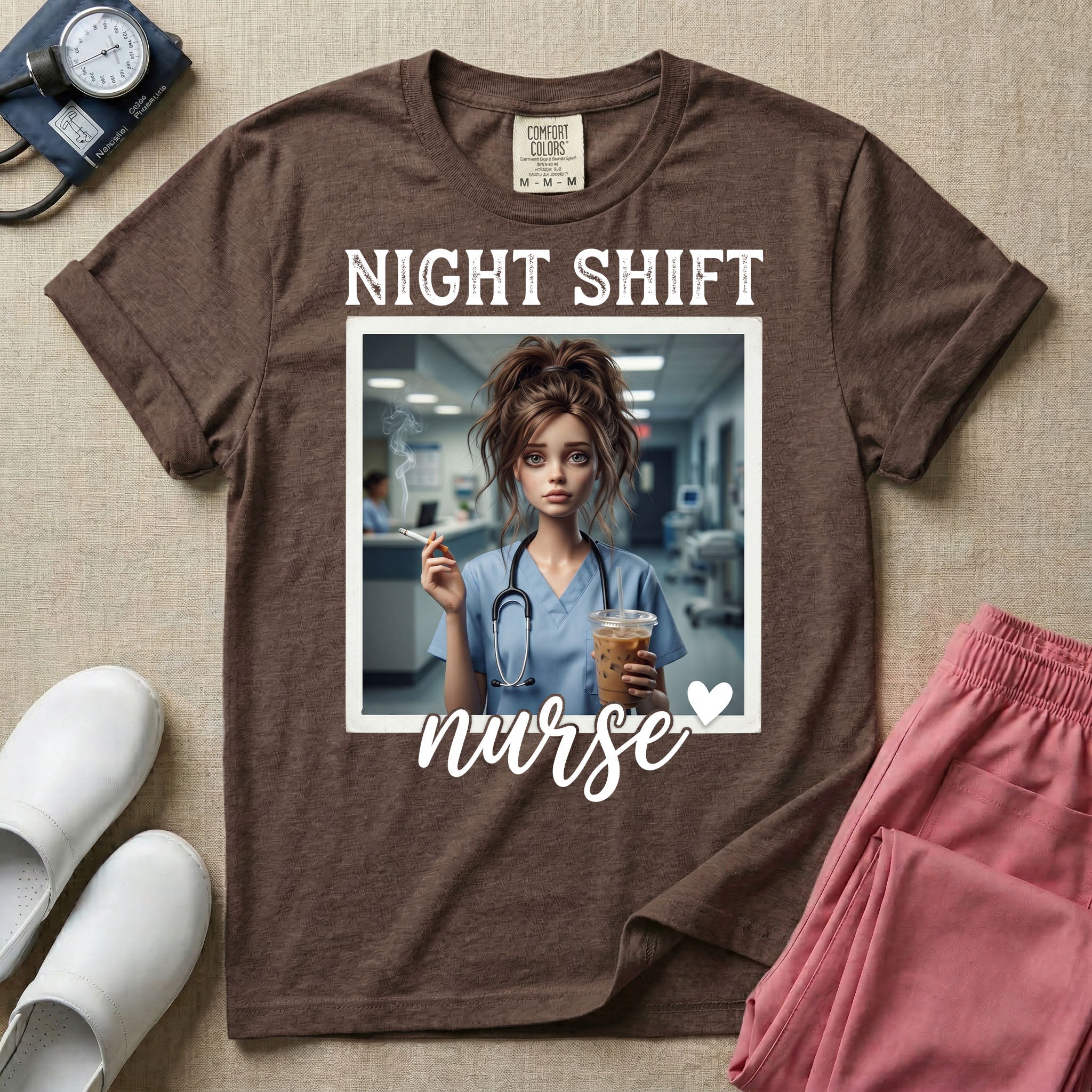 A graphic featuring the words "NIGHT SHIFT" above a framed image of an exhausted nurse in scrubs holding a lit cigarette and a large iced coffee, with the word "nurse" in cursive and a small heart below, designed for general nursing.
