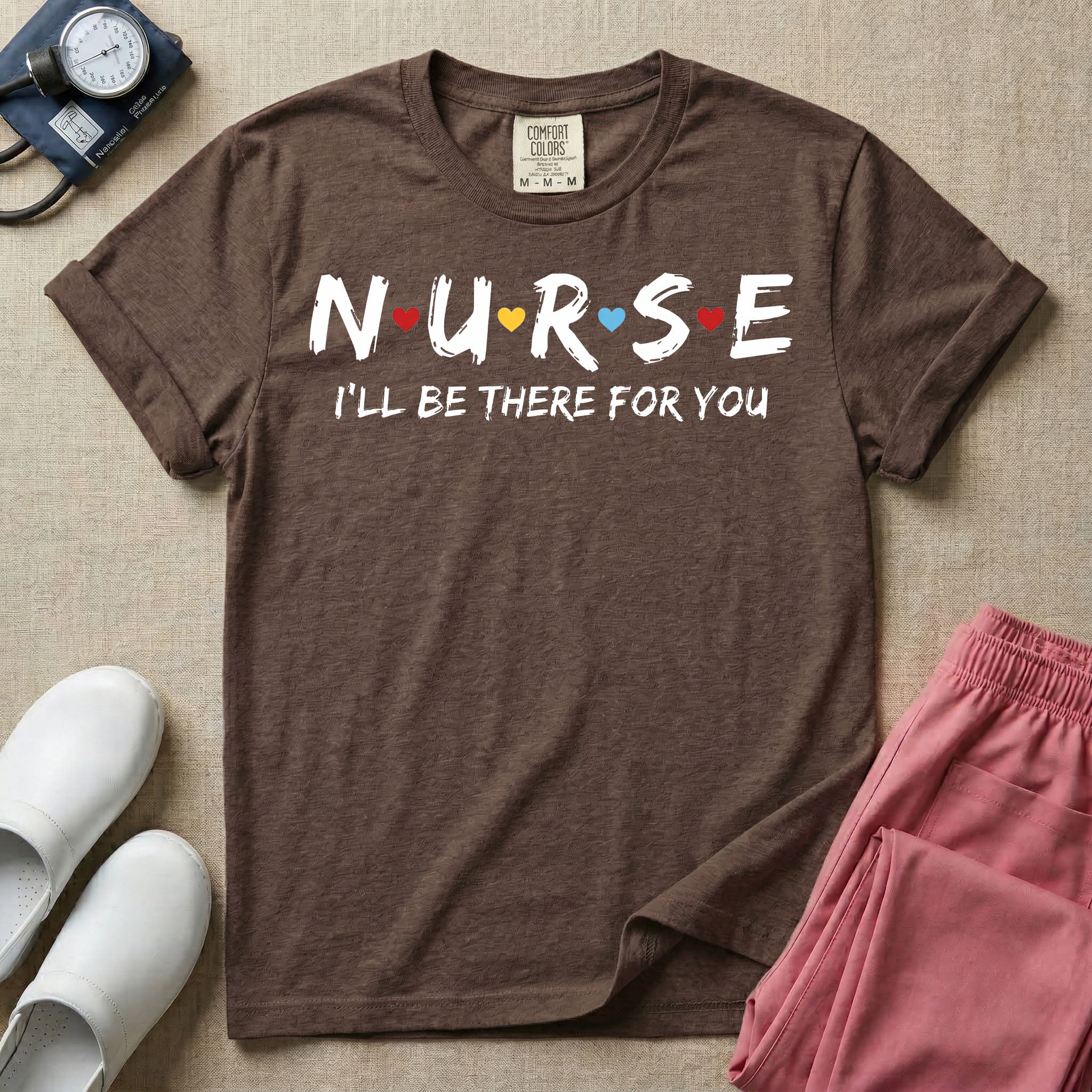 A graphic featuring the word NURSE in a stylized white font with small red, yellow, and blue hearts separating the letters, positioned above the phrase I'LL BE THERE FOR YOU in matching white text, designed for general nursing.