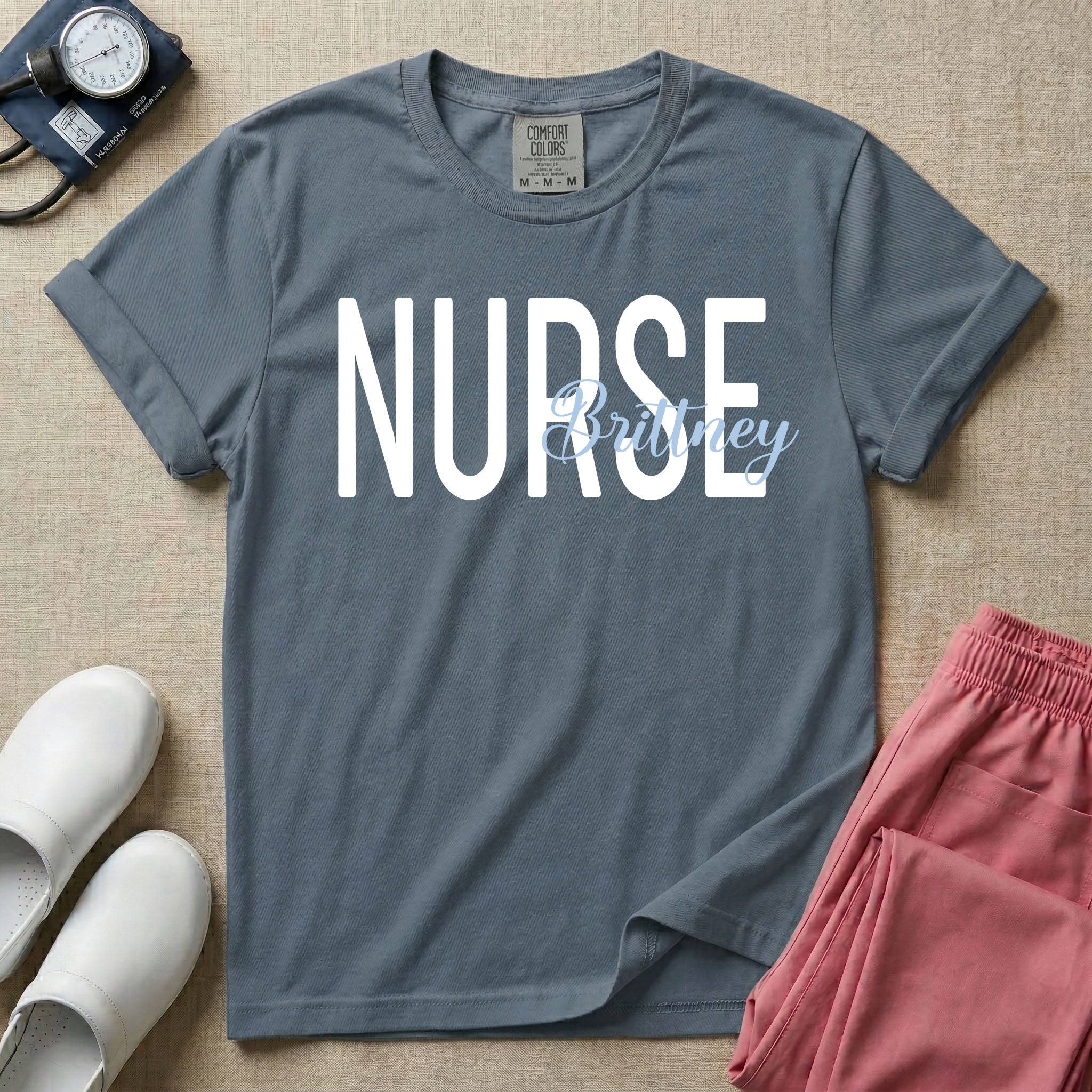 A minimalist graphic featuring the word NURSE in a large, bold font with the custom name Brittney overlapping it in an elegant cursive script, designed for general nursing.
