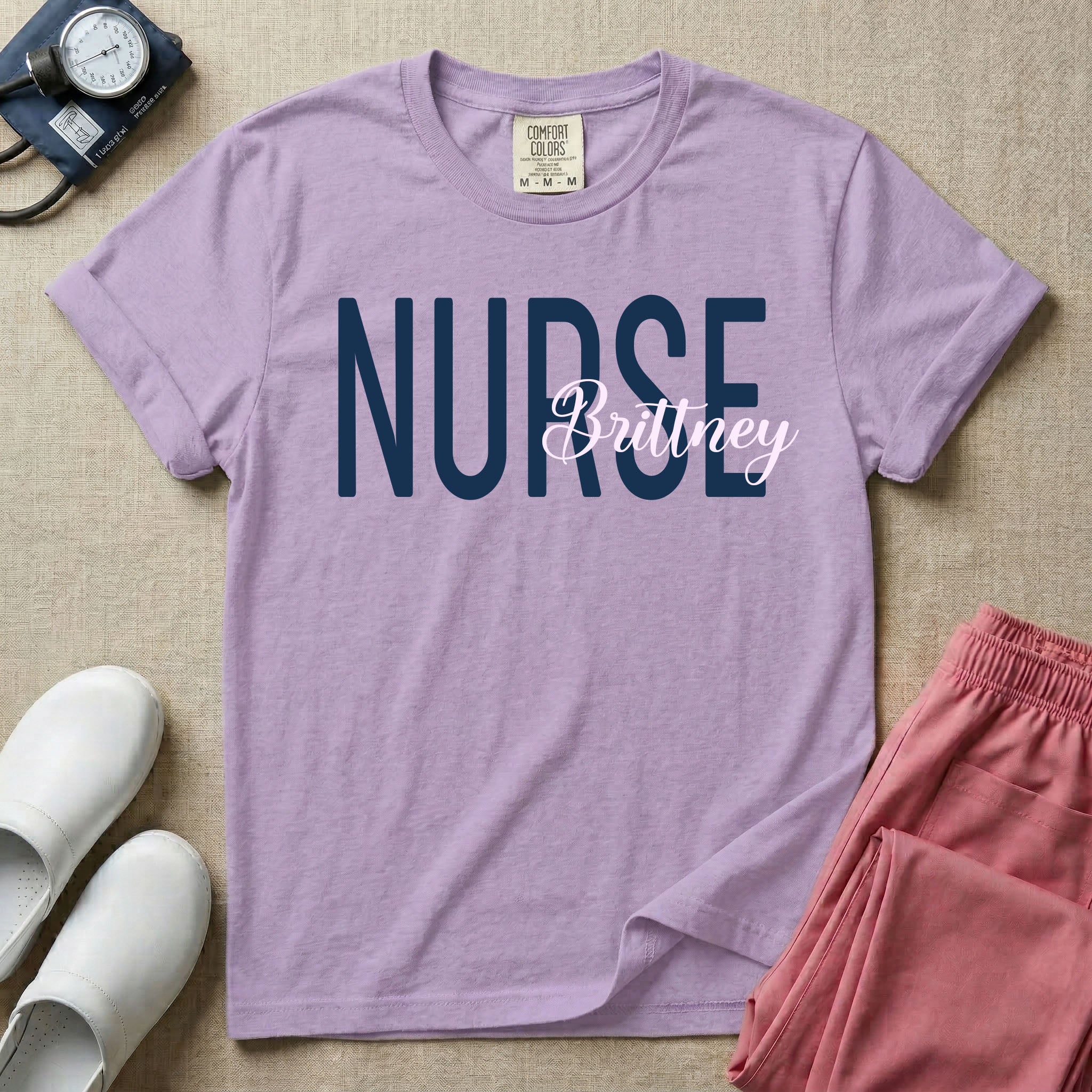 A minimalist graphic featuring the word NURSE in a large, bold font with the custom name Brittney overlapping it in an elegant cursive script, designed for general nursing.