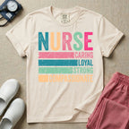 A retro graphic design for general nursing featuring the word NURSE in large, colorful distressed block letters above horizontal stripes reading CARING, LOYAL, STRONG, and COMPASSIONATE.