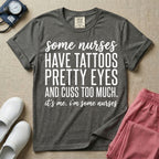 A funny graphic design for general nursing featuring white typography that reads some nurses HAVE TATTOOS PRETTY EYES AND CUSS TOO MUCH. it's me. i'm some nurses.