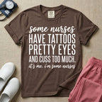 A funny graphic design for general nursing featuring white typography that reads some nurses HAVE TATTOOS PRETTY EYES AND CUSS TOO MUCH. it's me. i'm some nurses.