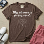 A minimalist graphic design for NICU nursing featuring the text Big advocate for tiny patients in white lettering above a continuous line art illustration of two hands gently holding a small baby footprint.