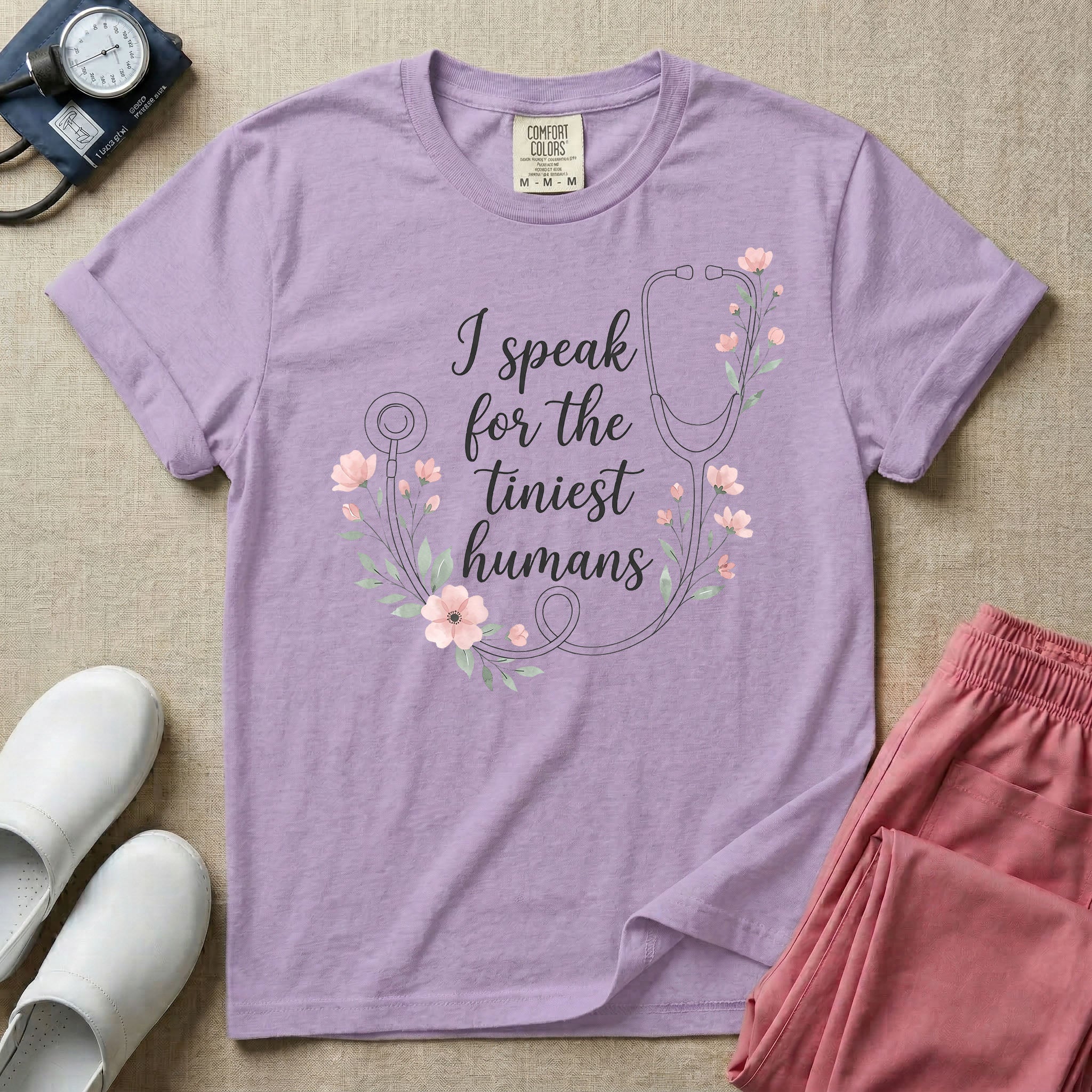 A boho floral graphic design featuring a delicate line-art stethoscope wrapped in soft pink flowers and green leaves, with the text I speak for the tiniest humans written in the center in an elegant script.