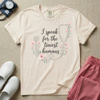 A boho floral graphic design featuring a delicate line-art stethoscope wrapped in soft pink flowers and green leaves, with the text I speak for the tiniest humans written in the center in an elegant script.