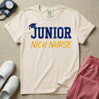 A graphic design for NICU nursing featuring a graduation cap resting on the word JUNIOR in distressed collegiate block letters, with NICU NURSE written below in a casual script.