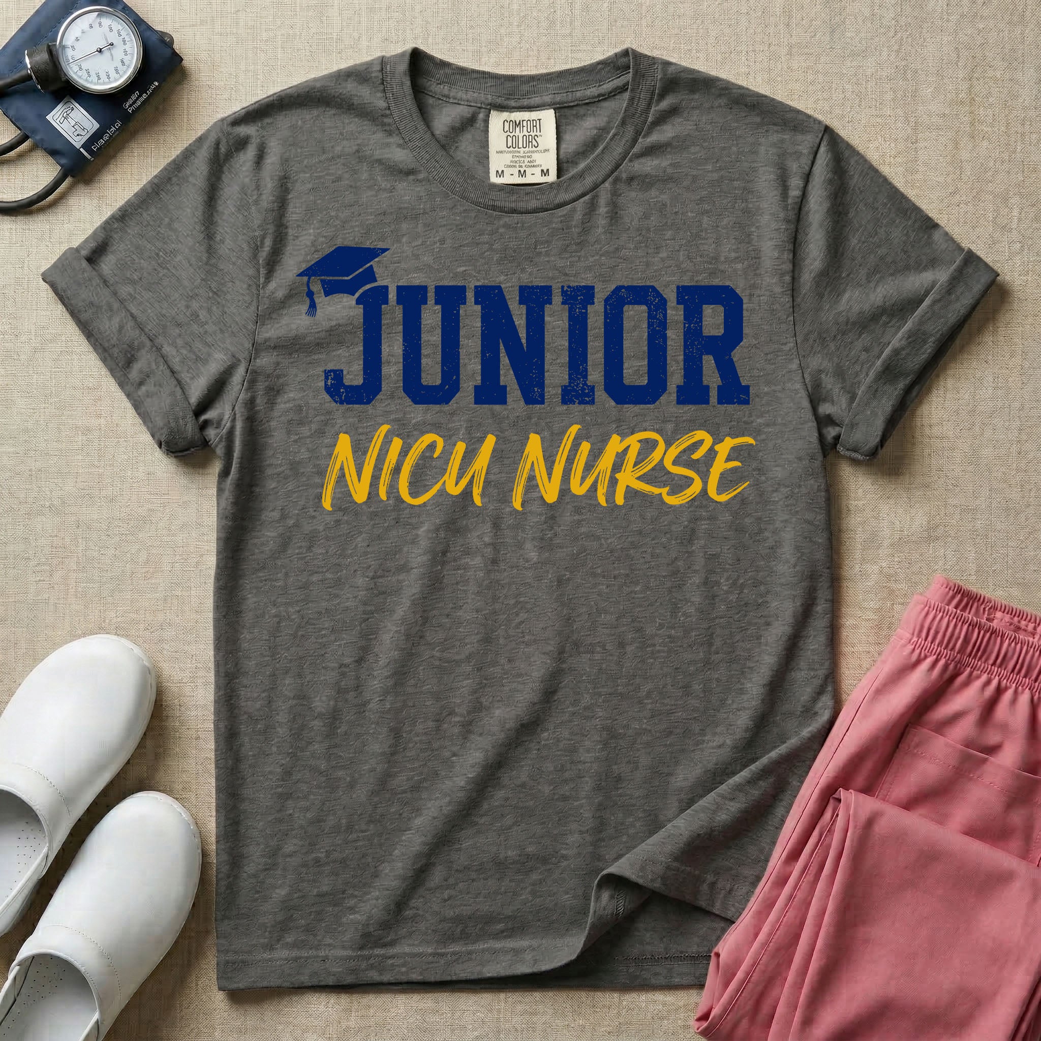 A graphic design for NICU nursing featuring a graduation cap resting on the word JUNIOR in distressed collegiate block letters, with NICU NURSE written below in a casual script.