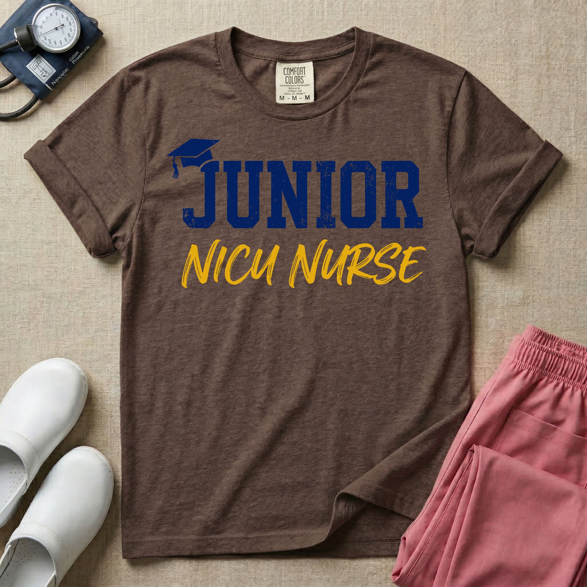 A graphic design for NICU nursing featuring a graduation cap resting on the word JUNIOR in distressed collegiate block letters, with NICU NURSE written below in a casual script.