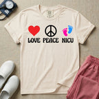 A retro graphic design for NICU nursing featuring a red heart, a white peace sign, and a pair of pink and blue baby footprints, positioned above the words LOVE PEACE NICU in a white groovy font.