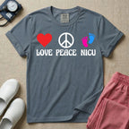 A retro graphic design for NICU nursing featuring a red heart, a white peace sign, and a pair of pink and blue baby footprints, positioned above the words LOVE PEACE NICU in a white groovy font.