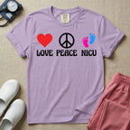A retro graphic design for NICU nursing featuring a red heart, a white peace sign, and a pair of pink and blue baby footprints, positioned above the words LOVE PEACE NICU in a white groovy font.
