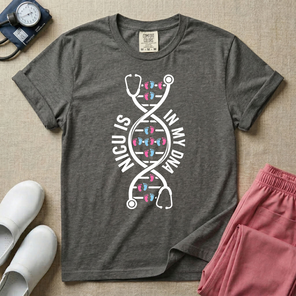 A graphic design for NICU nursing featuring a white DNA double helix structure intertwined with a stethoscope, where the rungs of the DNA strand are made of tiny pink and blue baby footprints, accompanied by the text NICU IS on the left and IN MY DNA on the right.