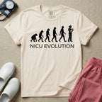 A funny minimalist graphic design for NICU nursing featuring a white silhouette illustration of human evolution progressing from an ape to a modern human, culminating in a nurse wearing scrubs holding a newborn baby, with the text NICU EVOLUTION written directly below.