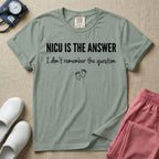 A funny neonatal intensive care unit nurse t-shirt featuring the text "NICU IS THE ANSWER I don't remember the question" with minimalist baby footprint graphics.