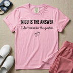 A funny neonatal intensive care unit nurse t-shirt featuring the text "NICU IS THE ANSWER I don't remember the question" with minimalist baby footprint graphics.