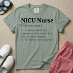 A minimalist neonatal intensive care unit t-shirt featuring a funny dictionary definition graphic that reads "NICU Nurse [ nik-yoo nurs ] 1. A sleep-deprived superhero who cares for the tiniest humans. 2. A creator of miracles."