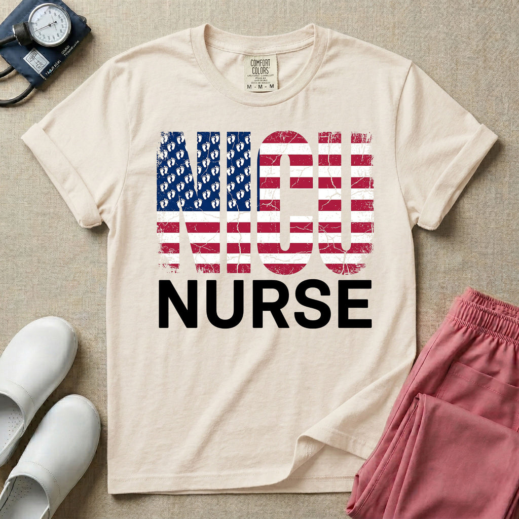 A retro neonatal intensive care unit t-shirt featuring the text "NICU NURSE" with a distressed American flag graphic inside the letters, replacing the traditional stars with tiny white baby footprints.