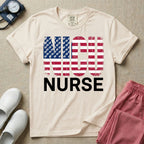 A retro neonatal intensive care unit t-shirt featuring the text "NICU NURSE" with a distressed American flag graphic inside the letters, replacing the traditional stars with tiny white baby footprints.