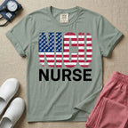 A retro neonatal intensive care unit t-shirt featuring the text "NICU NURSE" with a distressed American flag graphic inside the letters, replacing the traditional stars with tiny white baby footprints.