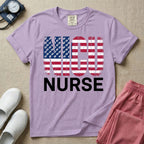 A retro neonatal intensive care unit t-shirt featuring the text "NICU NURSE" with a distressed American flag graphic inside the letters, replacing the traditional stars with tiny white baby footprints.