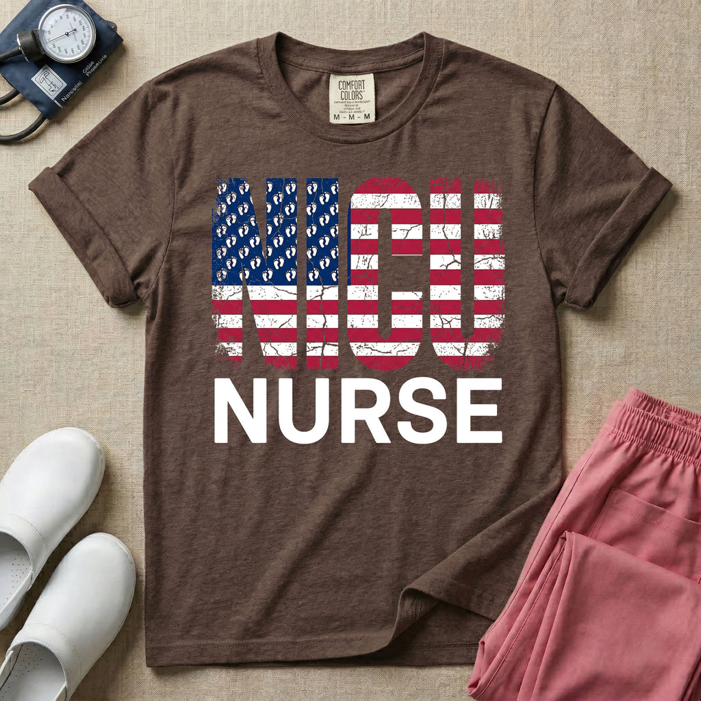 A retro neonatal intensive care unit t-shirt featuring the text "NICU NURSE" with a distressed American flag graphic inside the letters, replacing the traditional stars with tiny white baby footprints.