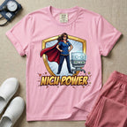 A comic book style neonatal intensive care unit t-shirt featuring an illustration of a confident female nurse wearing a red superhero cape and mask, standing next to an infant incubator inside a golden shield, with the bold text "NICU POWER" below.