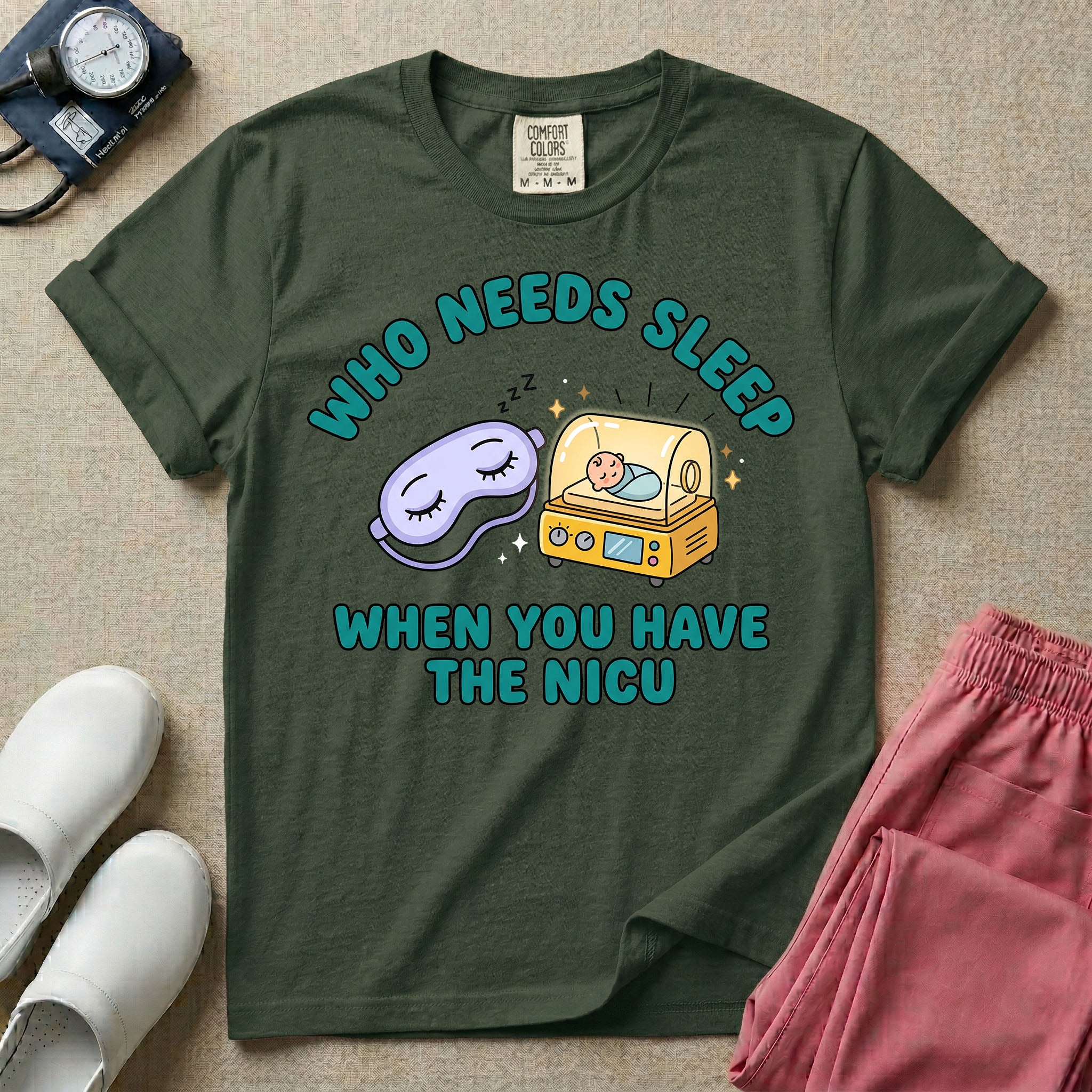 A funny neonatal intensive care unit t-shirt featuring an illustration of a purple sleep mask with Zs next to a yellow infant incubator with a baby inside, surrounded by the text "WHO NEEDS SLEEP WHEN YOU HAVE THE NICU" in a bold teal font.