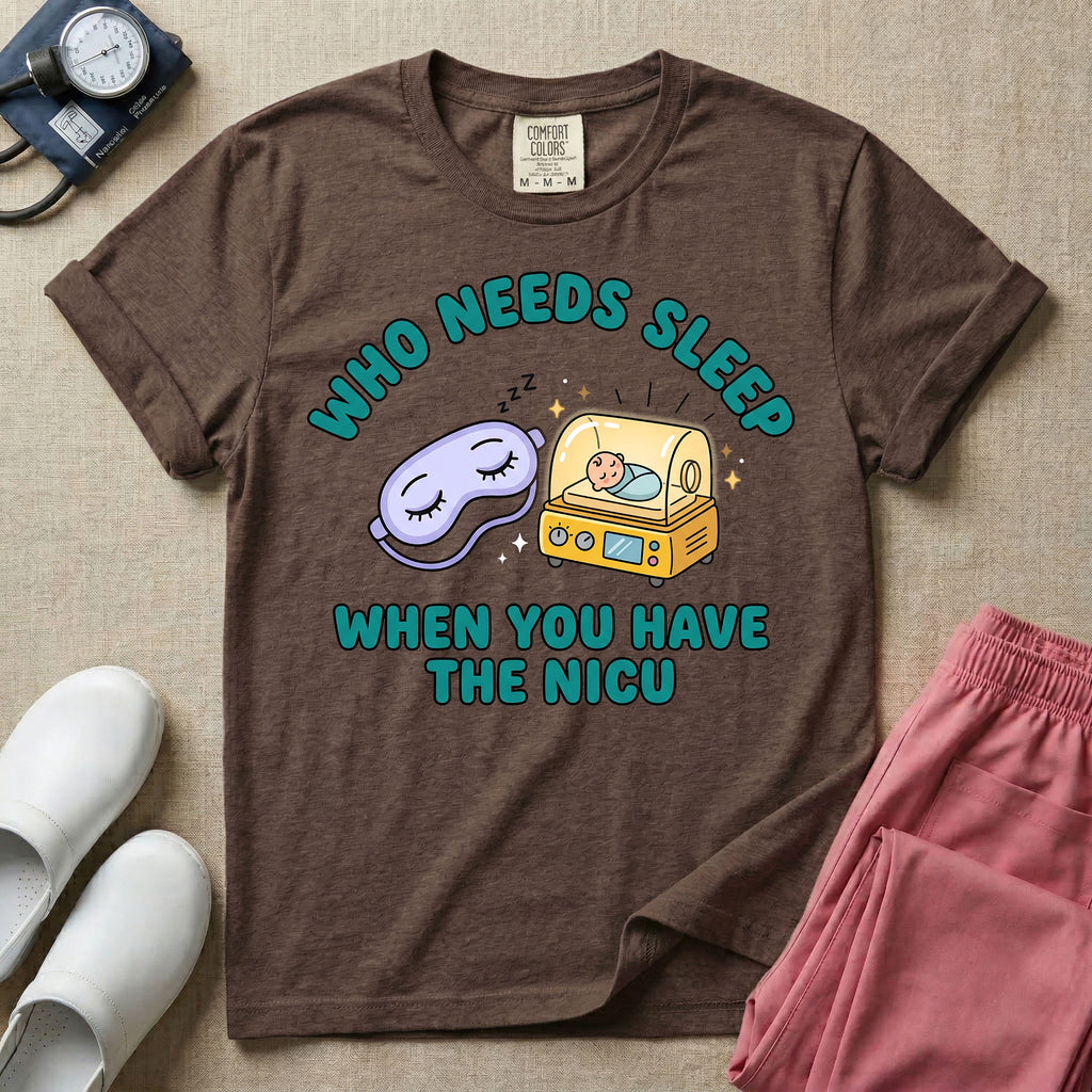 A funny neonatal intensive care unit t-shirt featuring an illustration of a purple sleep mask with Zs next to a yellow infant incubator with a baby inside, surrounded by the text "WHO NEEDS SLEEP WHEN YOU HAVE THE NICU" in a bold teal font.
