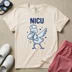 A cute and funny t-shirt design for neonatal intensive care unit nurses featuring a cartoon stork wearing a stethoscope and nurse hat while performing a dabbing dance pose beneath bold letters that read NICU.