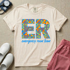 A retro-style design for emergency room staff featuring the large letters ER filled with a checkered pattern and small lightning bolts, above the script text emergency room team.