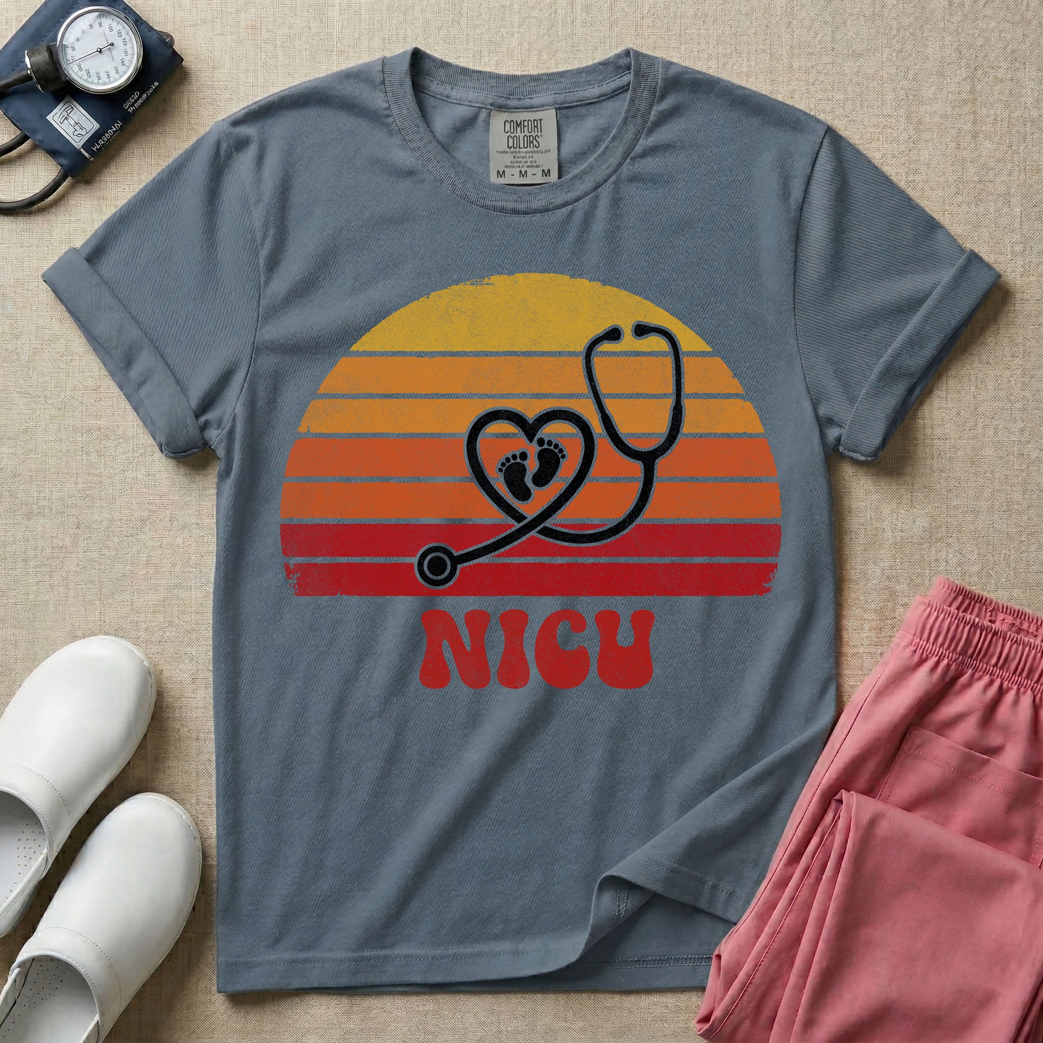 Retro vintage graphic featuring a distressed sunset background with a heart-shaped stethoscope enclosing tiny baby footprints above the bold text NICU.
