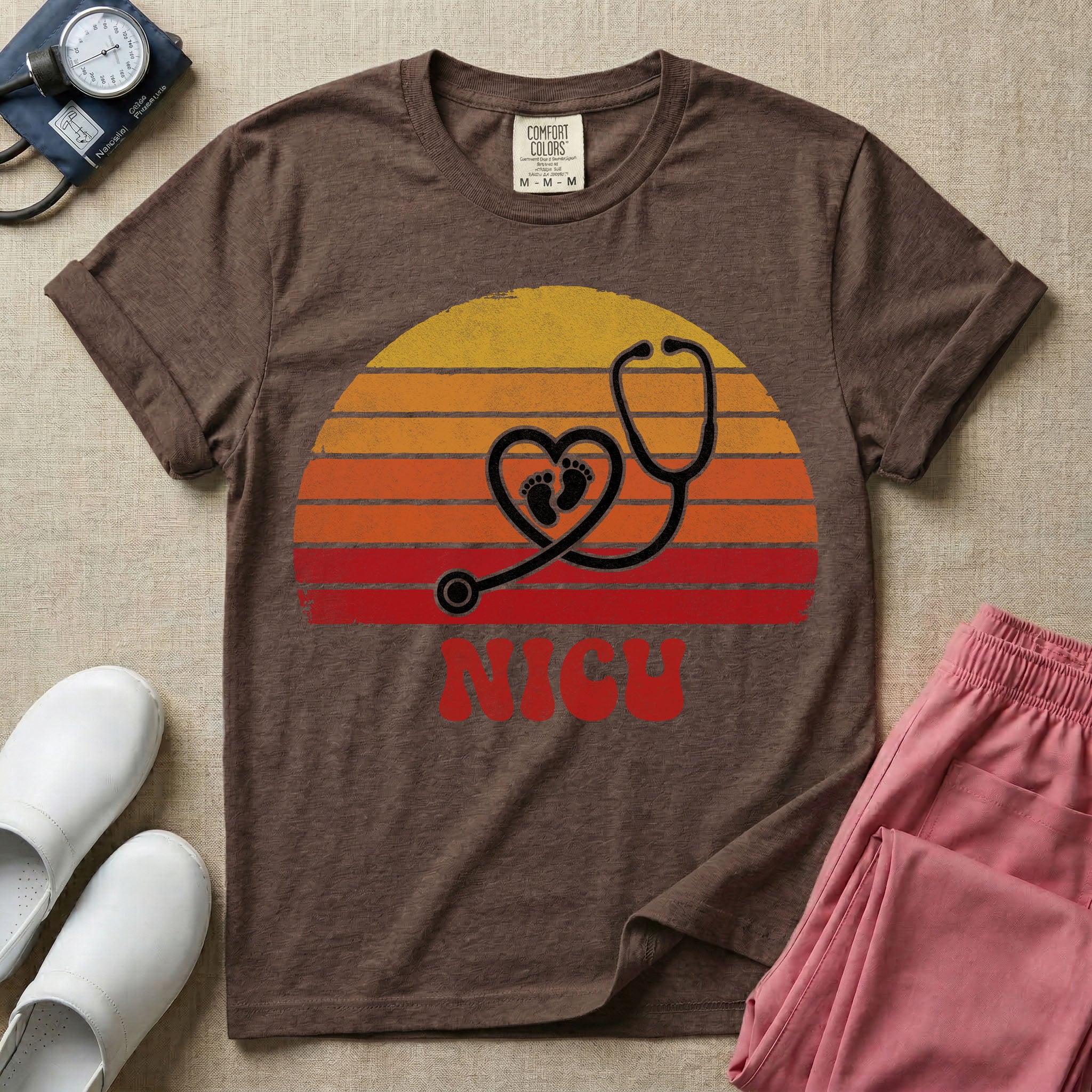 Retro vintage graphic featuring a distressed sunset background with a heart-shaped stethoscope enclosing tiny baby footprints above the bold text NICU.
