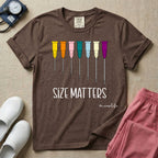 Graphic illustration of a row of colorful IV catheter needles in various gauge sizes lined up above the text SIZE MATTERS and nurselife hashtag.