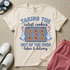 Christmas Labor and Delivery nurse design featuring the text Taking The Cutest Cookies Out Of The Oven surrounded by a baking sheet of gingerbread baby cookies in Santa hats, oven mitts, candy canes, and script text reading labor and delivery.