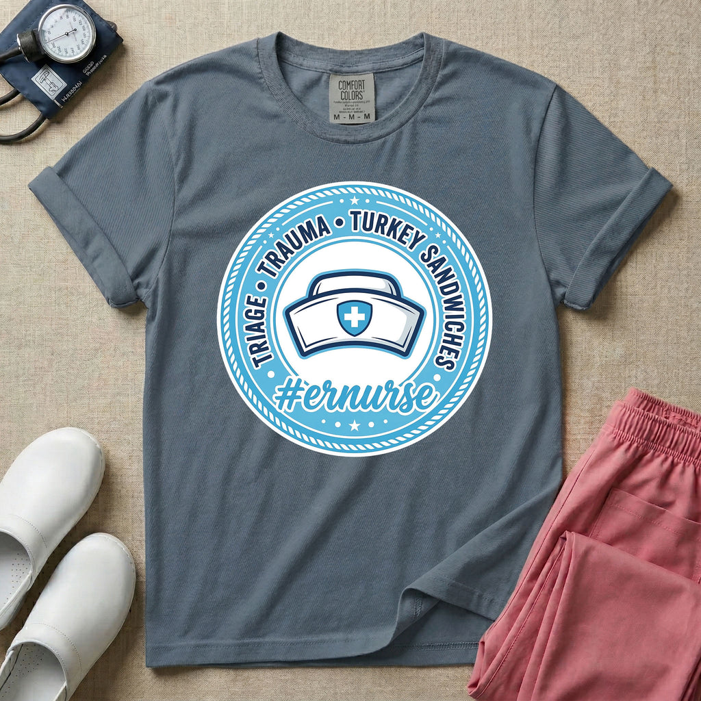 Funny Emergency Room nurse design featuring a circular rope badge emblem with a classic nurse cap centered inside, bordered by stars and the text Triage Trauma Turkey Sandwiches with hashtag er nurse.
