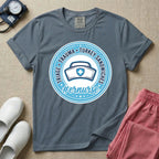 Funny Emergency Room nurse design featuring a circular rope badge emblem with a classic nurse cap centered inside, bordered by stars and the text Triage Trauma Turkey Sandwiches with hashtag er nurse.