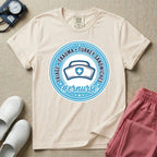 Funny Emergency Room nurse design featuring a circular rope badge emblem with a classic nurse cap centered inside, bordered by stars and the text Triage Trauma Turkey Sandwiches with hashtag er nurse.