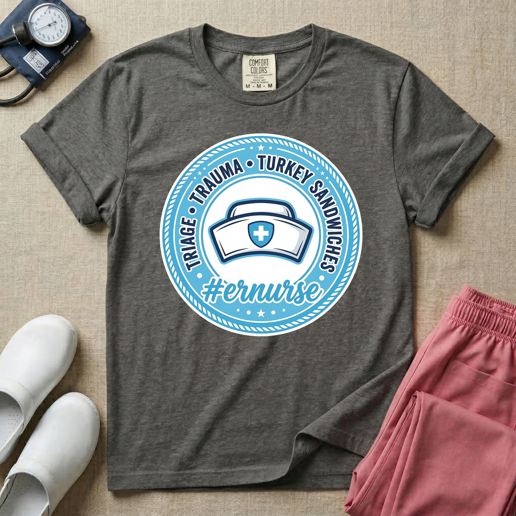 Funny Emergency Room nurse design featuring a circular rope badge emblem with a classic nurse cap centered inside, bordered by stars and the text Triage Trauma Turkey Sandwiches with hashtag er nurse.