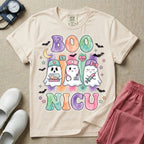 Cute Halloween NICU nurse design featuring watercolor textured retro bubble letters spelling Boo NICU with three ghost nurses holding an incubator baby, stethoscope, and syringe surrounded by bats and stars.