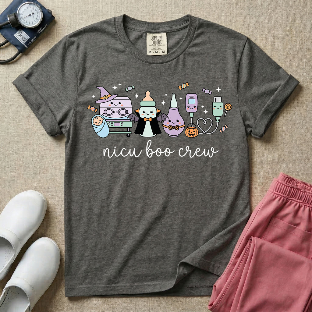 Cute Halloween NICU nurse graphic featuring kawaii medical equipment in costumes including an incubator wearing a witch hat, a baby bottle dressed as a vampire, a bulb syringe, and monitor sensors with candy above cursive text reading nicu boo crew.