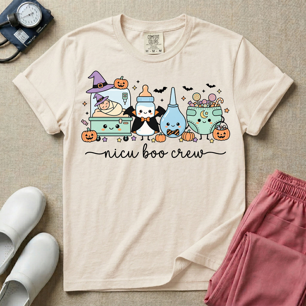 Cute Halloween NICU nurse graphic featuring kawaii characters including an incubator with a baby in witch hats, a vampire baby bottle, a bulb syringe with a bow tie, and a diaper filled with trick-or-treat candy above script text reading nicu boo crew.