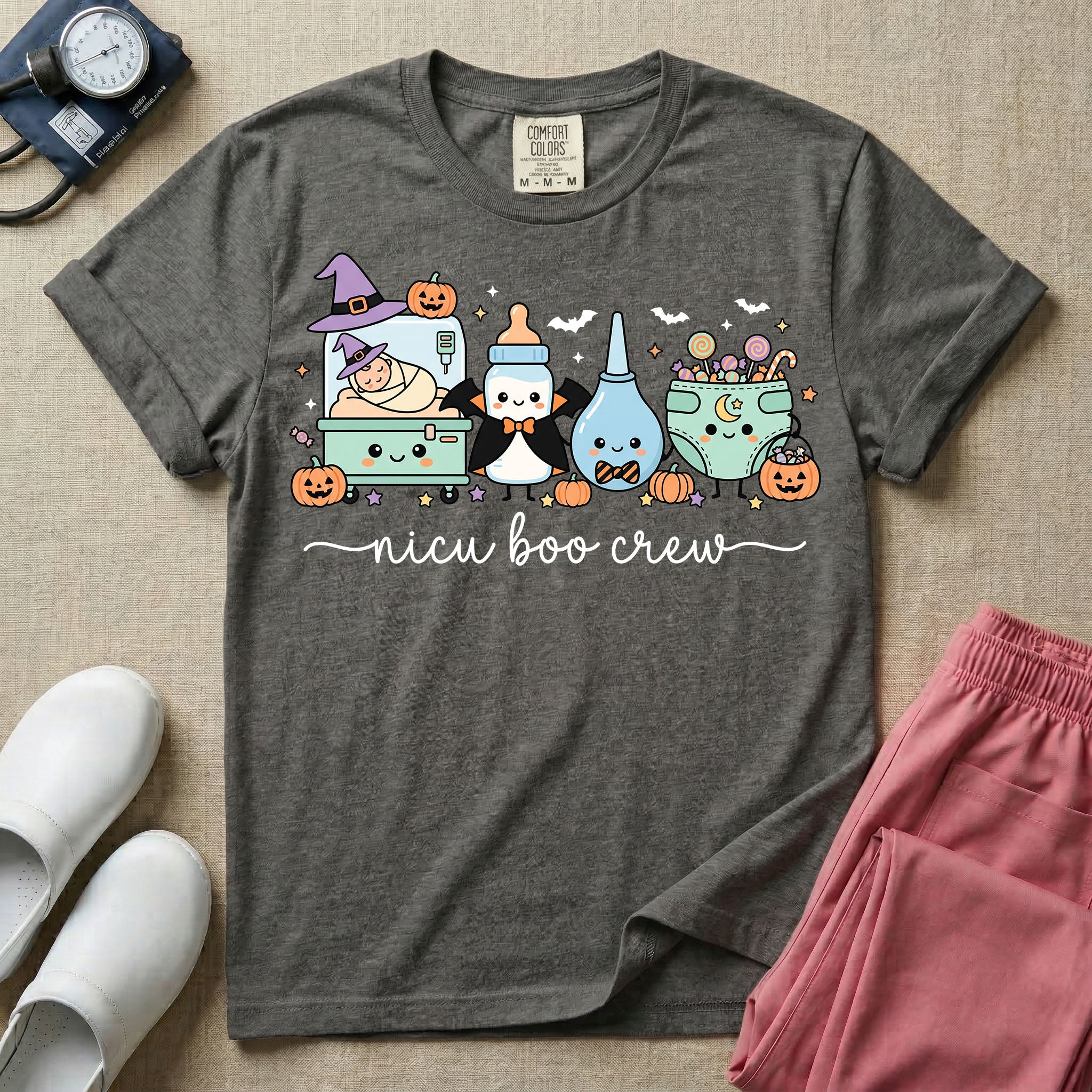 Cute Halloween NICU nurse graphic featuring kawaii characters including an incubator with a baby in witch hats, a vampire baby bottle, a bulb syringe with a bow tie, and a diaper filled with trick-or-treat candy above script text reading nicu boo crew.