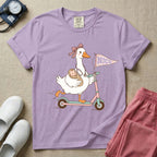 Cute NICU nurse design featuring an adorable goose wearing a ribbon bow and stethoscope riding a scooter while carrying a swaddled newborn baby, with a pennant flag reading NICU attached to the handlebars.